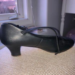 Used black character shoes